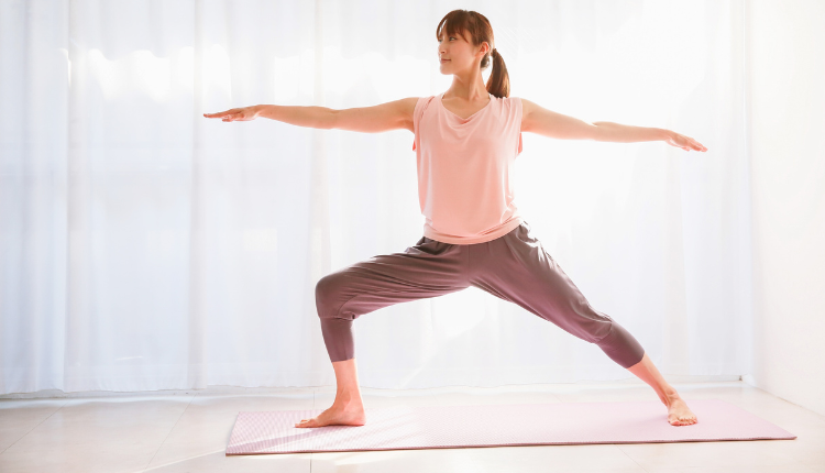 woman doing yoga at home