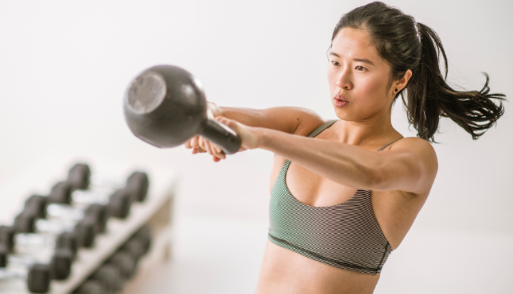 woman working out with a kettlebell