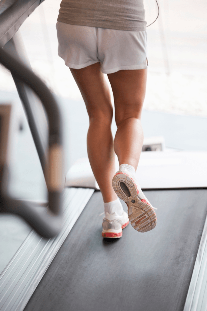 woman walking on a walking pad