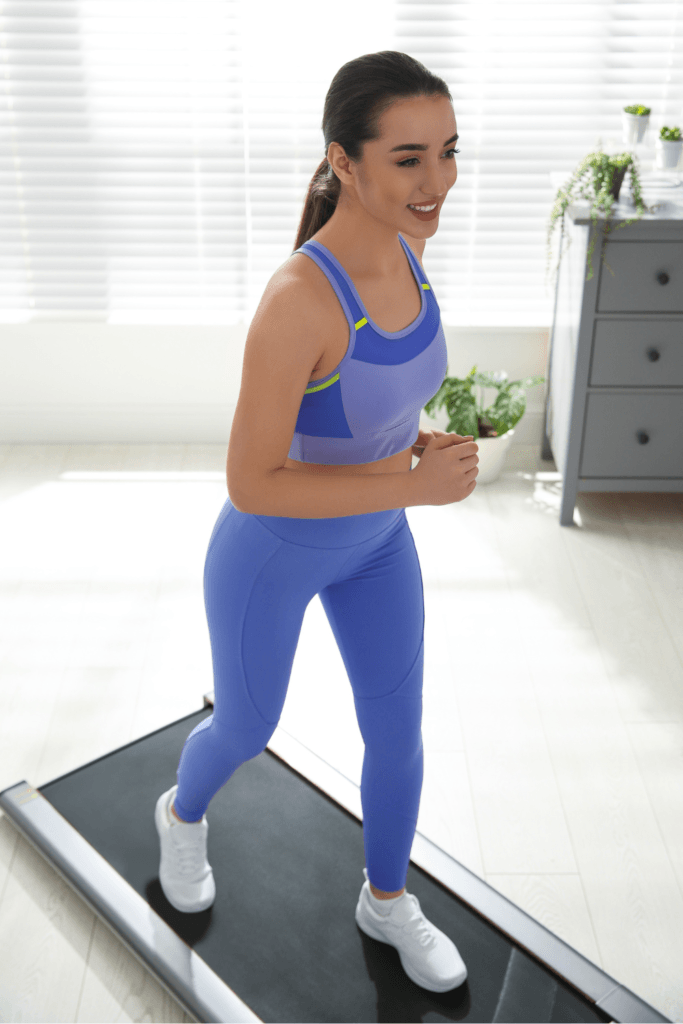 woman working out on a walking pad