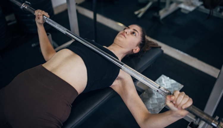 woman doing a bench press