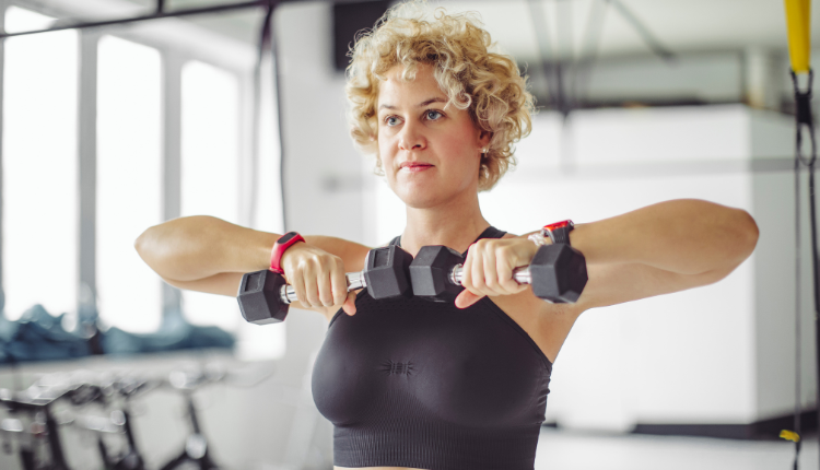 woman working out with dumbbells