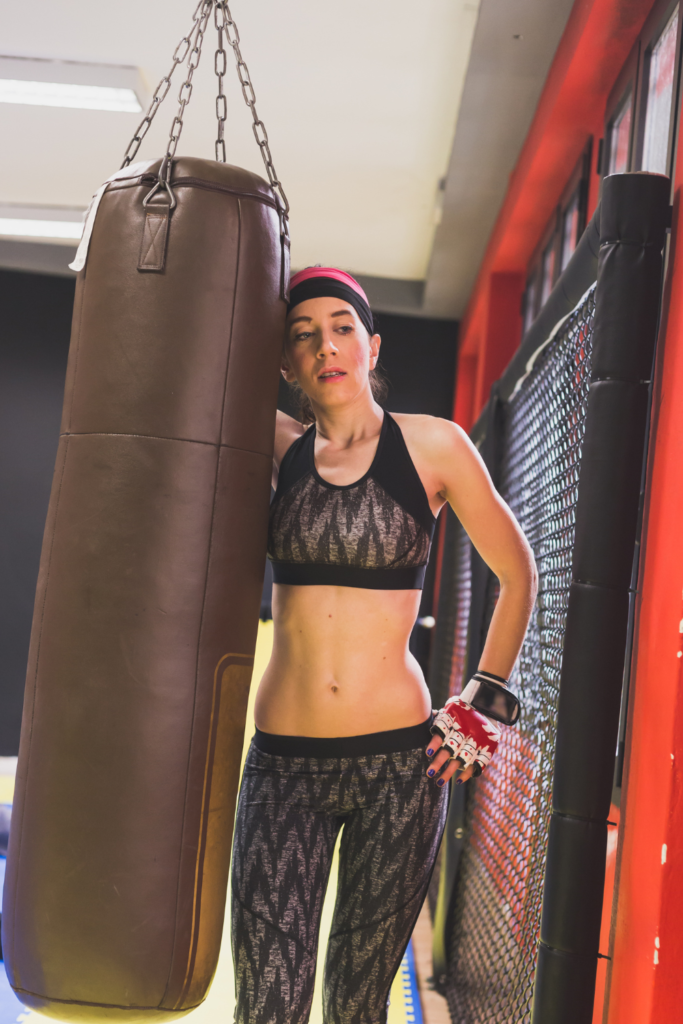 woman working out on a punching bag