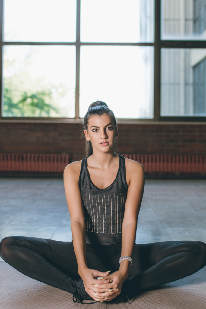 low impact workout at home with woman stretching