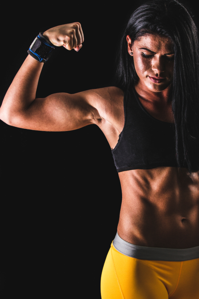 muscle mommy showing off bicep