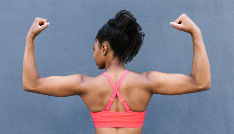 muscle mommy flexing at home