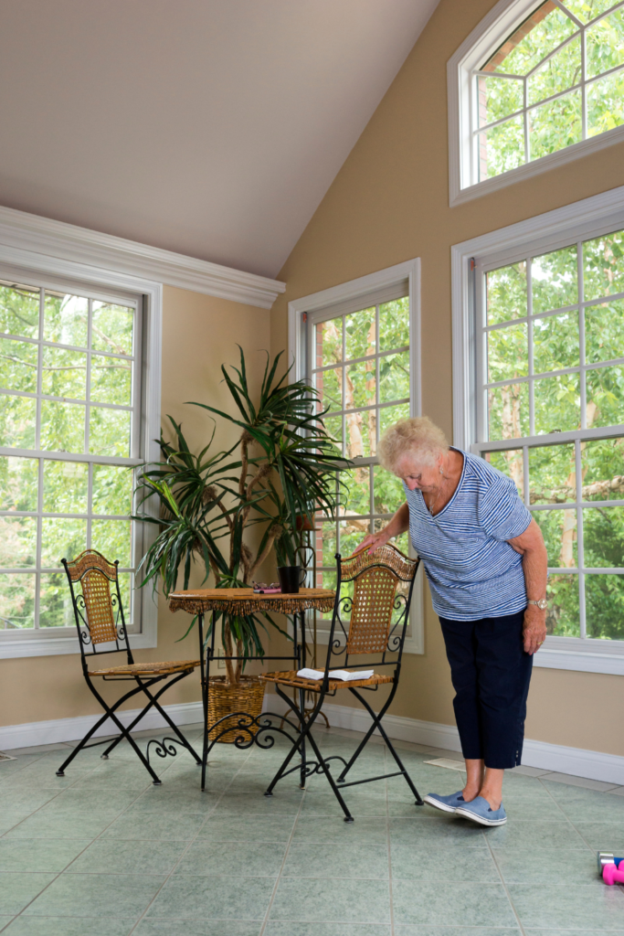 senior woman working on her balance at home