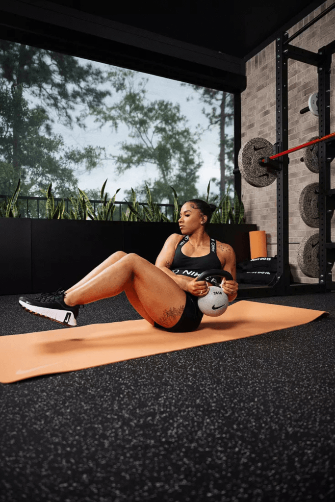 woman working out with a kettlebell at home