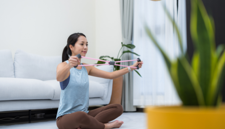 woman working out with a resistance band