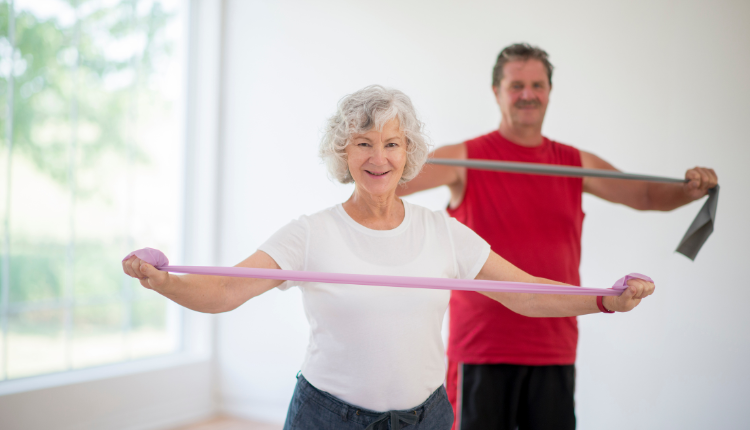 man and woman working out with resistance bands