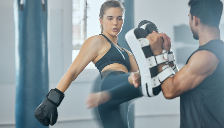 man and woman in a cardio kickboxing workout