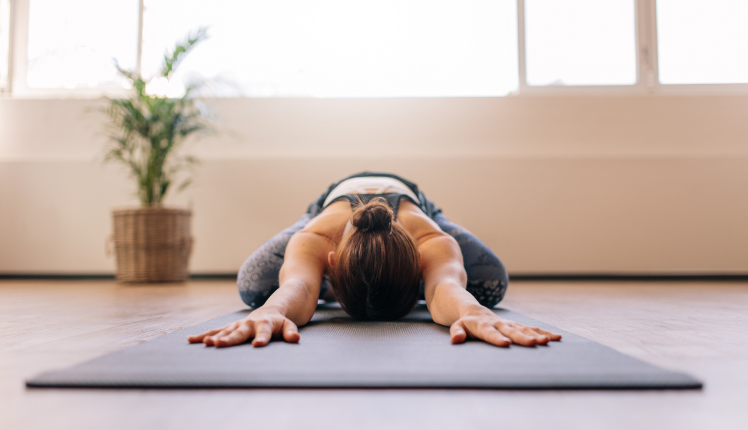 woman stretching from home