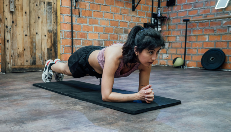 woman doing a plank exercise at home