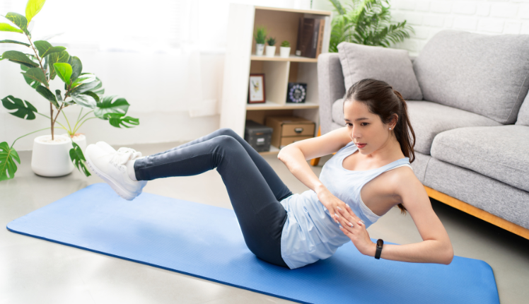 woman exercising to get rid of belly fat