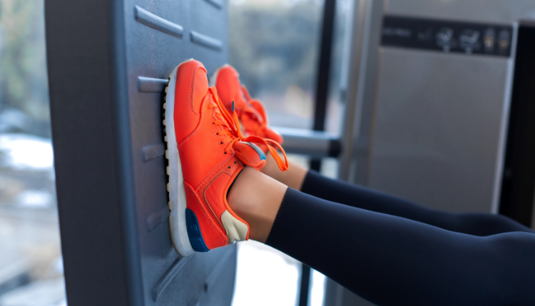 woman exercising on a leg press machine